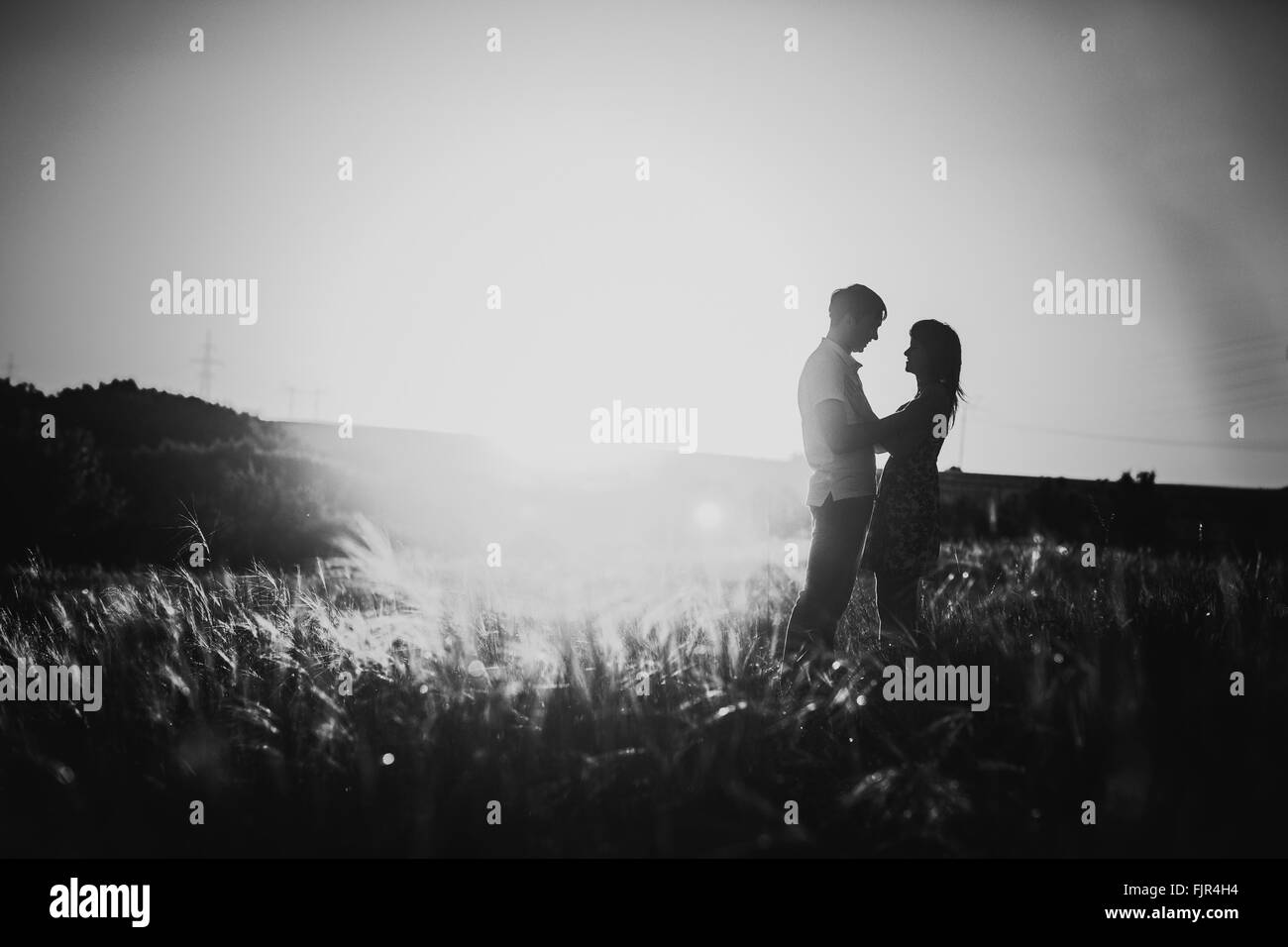 Black white photography romantic couple standing and kissing on ...