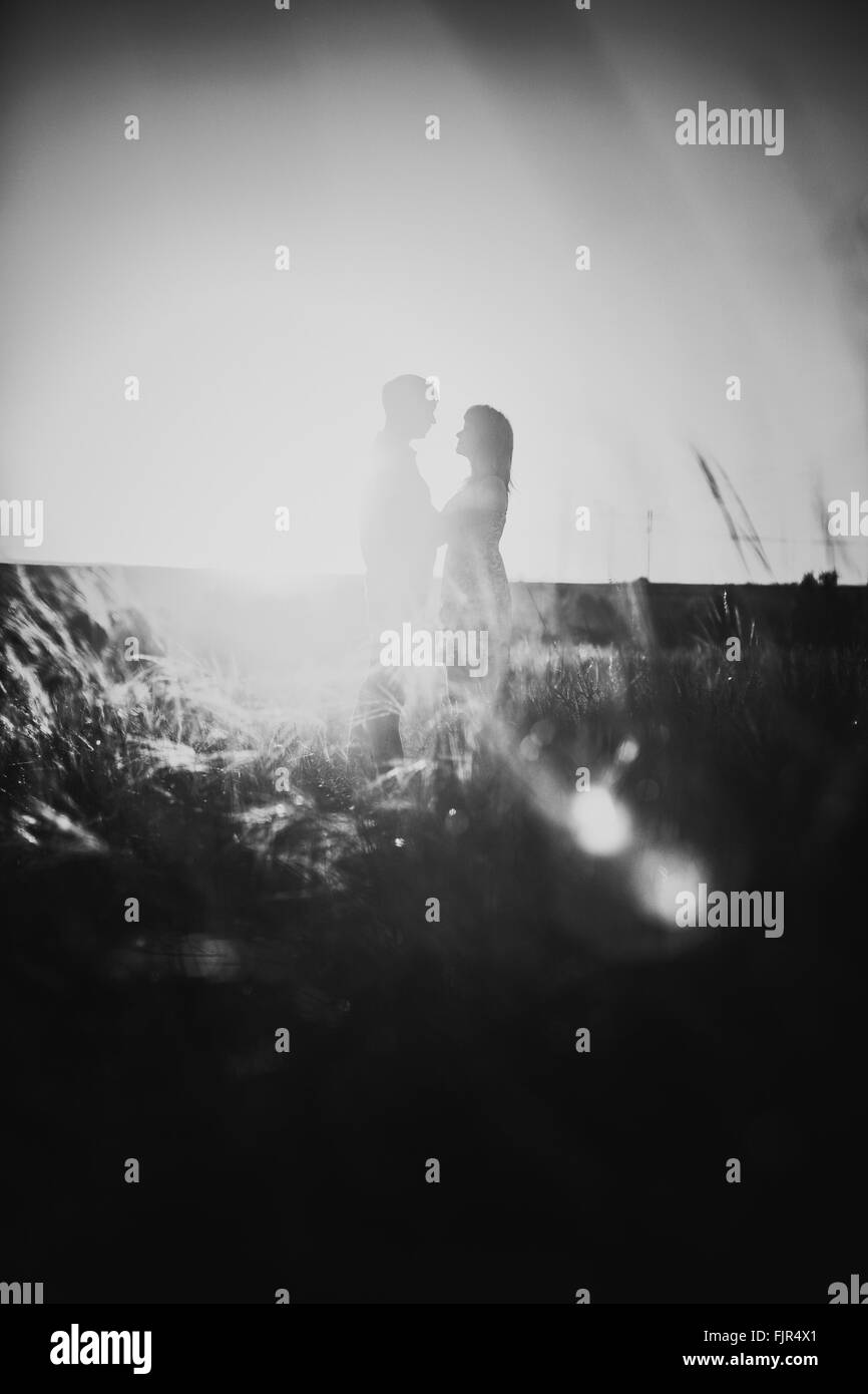 Black white photography romantic couple standing and kissing on ...