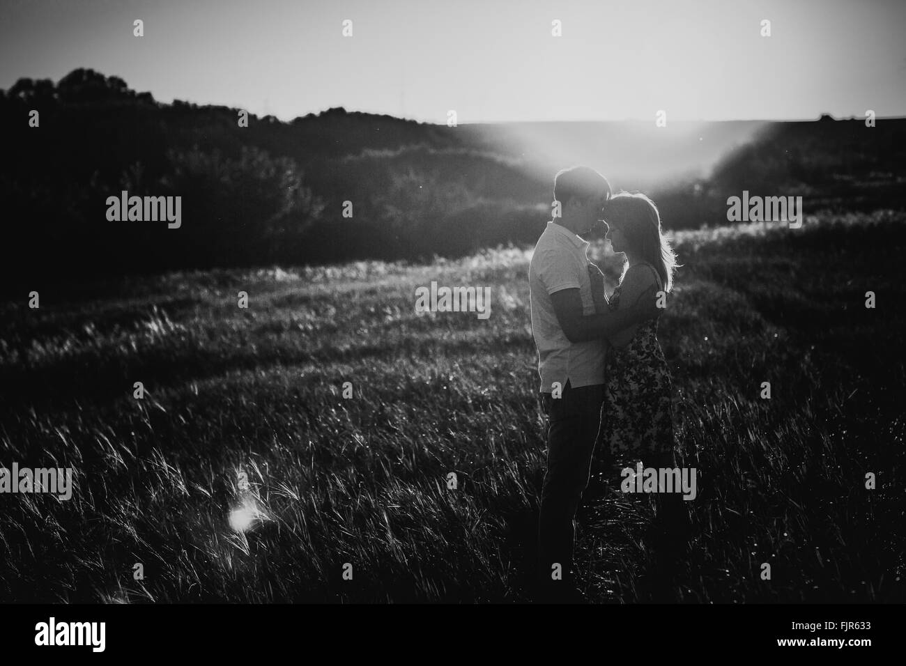 Black white photography romantic couple standing and kissing on ...