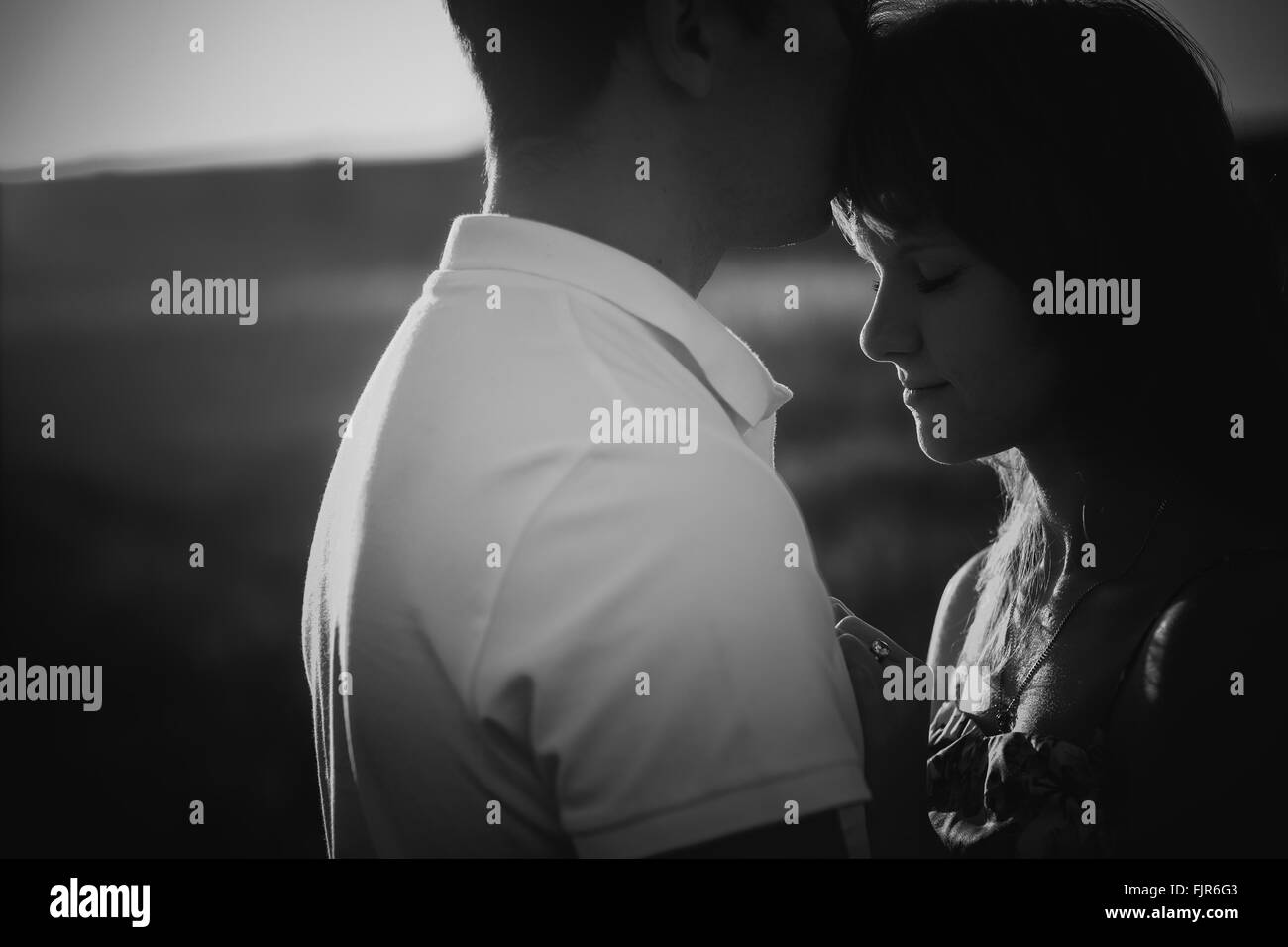 Black white photography romantic couple standing and kissing on ...