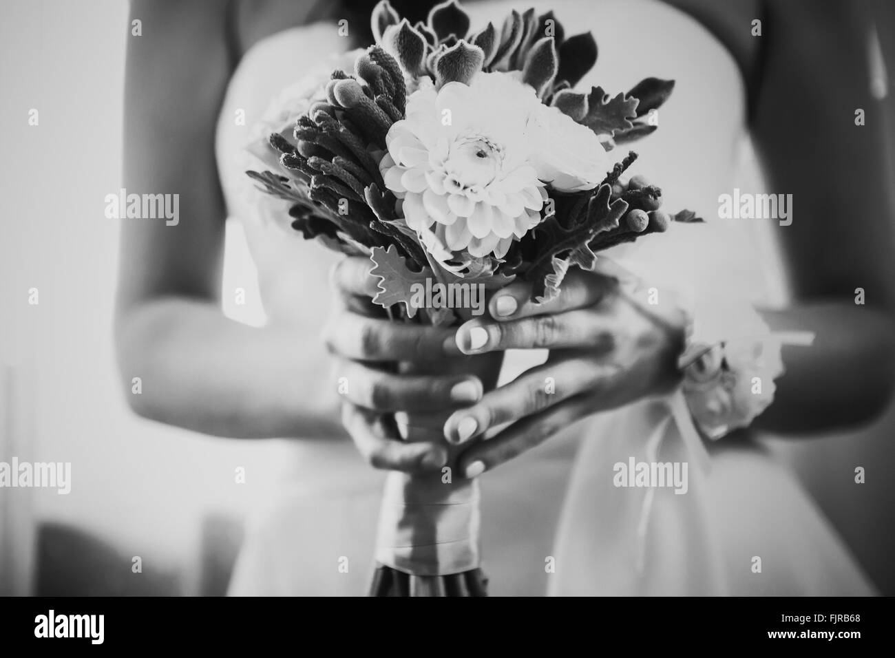 Black white photography beautiful wedding bouquet  of flowers in hands  the bride Stock Photo