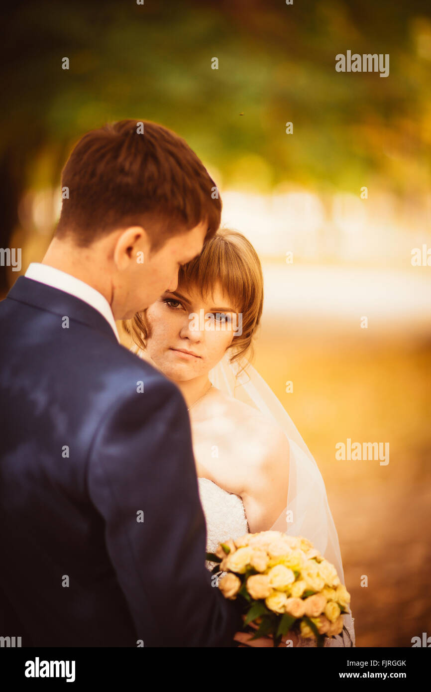 young bride and groom on the bluer background Stock Photo - Alamy