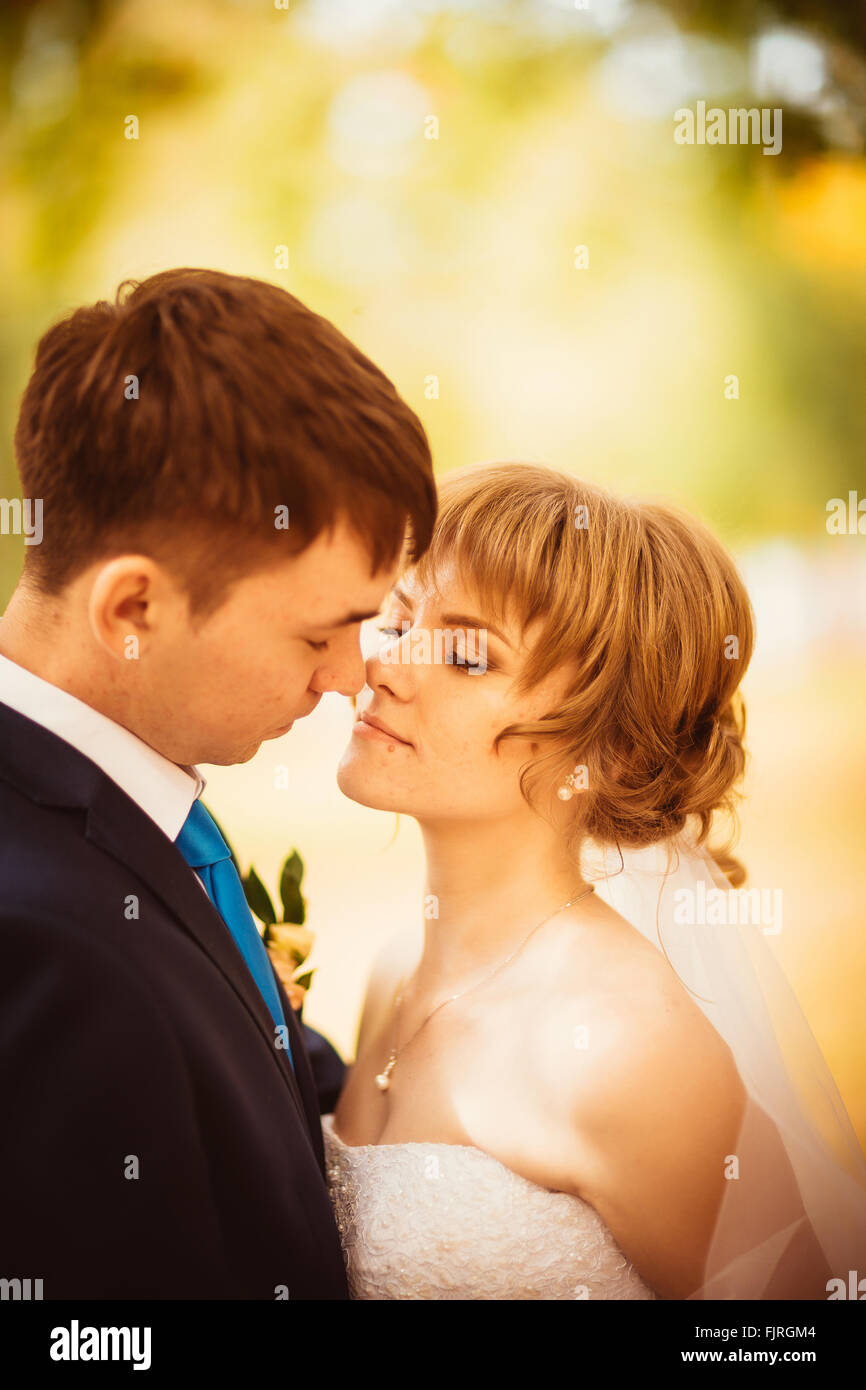 young bride and groom on  the bluer background Stock Photo