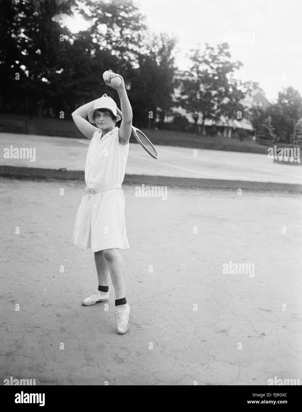Woman Playing Tennis, Chevy Chase, Maryland, USA, circa 1928 Stock Photo