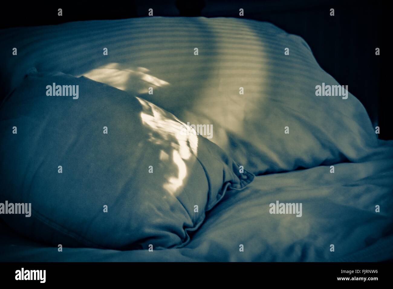 Sunlight falling pillow bed bed hires stock photography and images Alamy