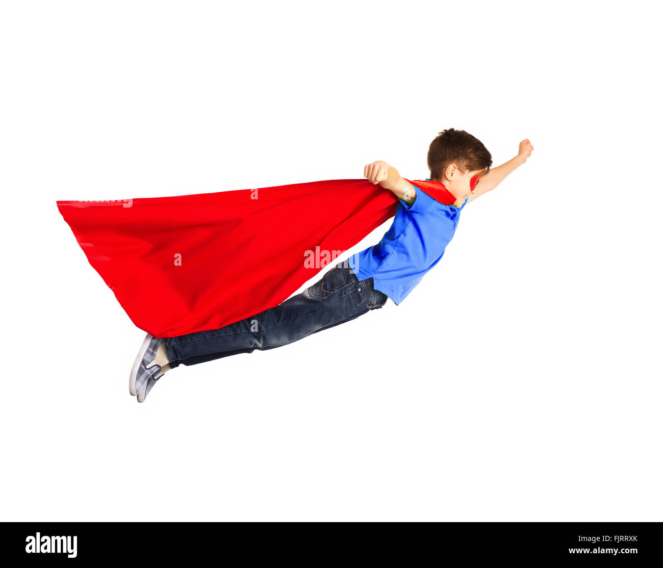 Brave superhero boy flying in studio Stock Photo by ©kegfire 542476666