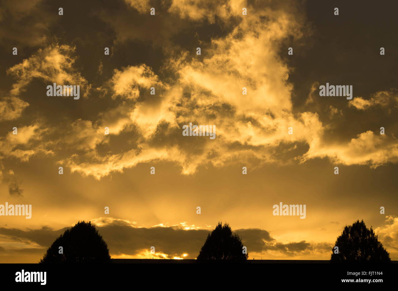 nice copper colored clouds during sunset Stock Photo