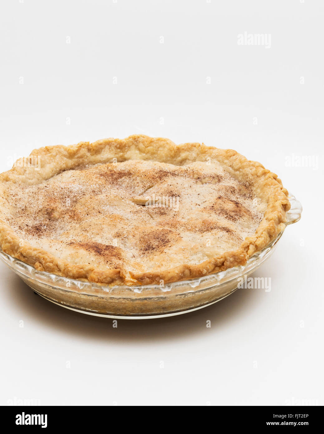 A whole homemade apple pie topped with cinnamon and sugar cutout. Stock Photo