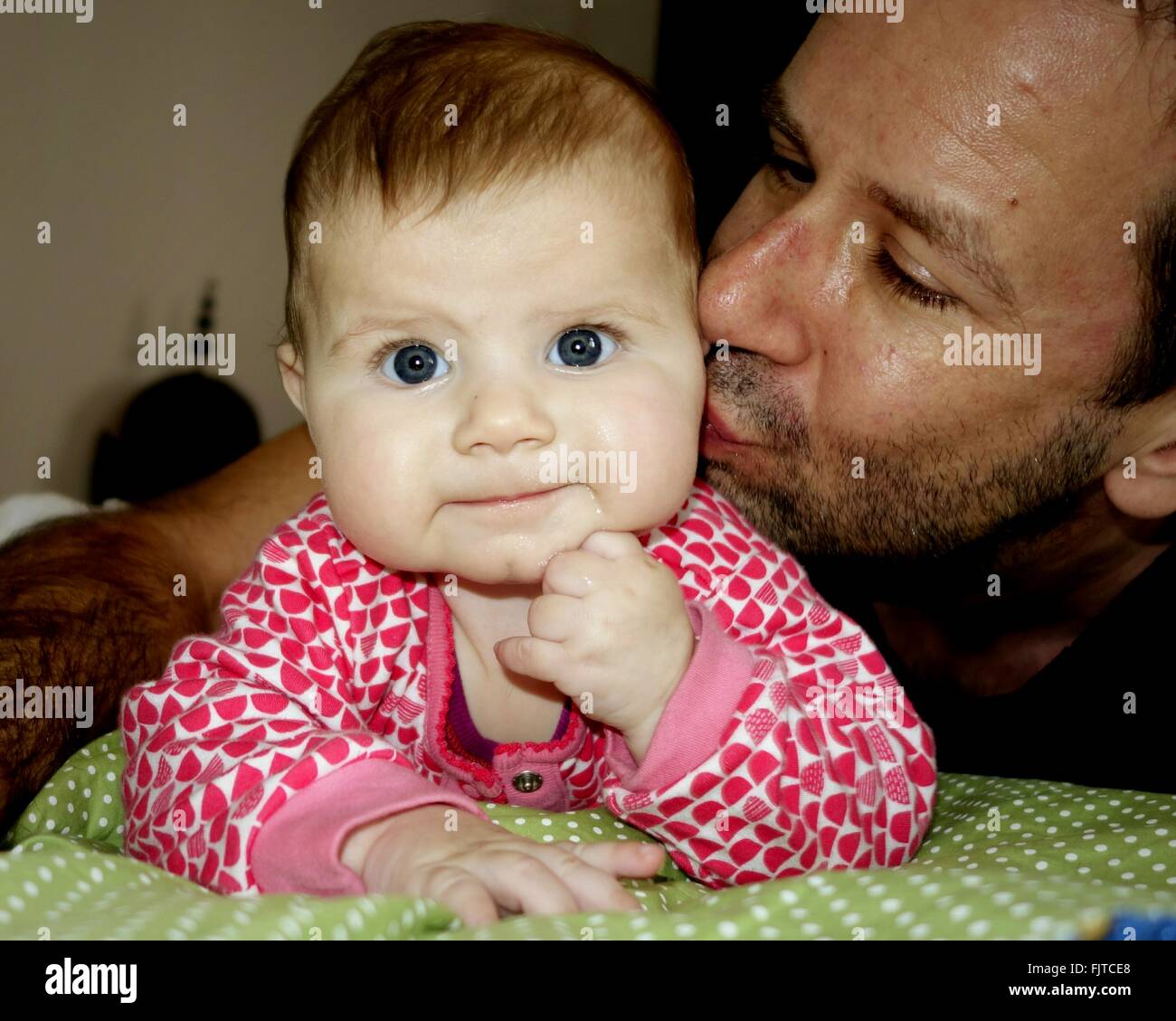 Father Kissing Cute Baby Boy On Bed Stock Photo Alamy