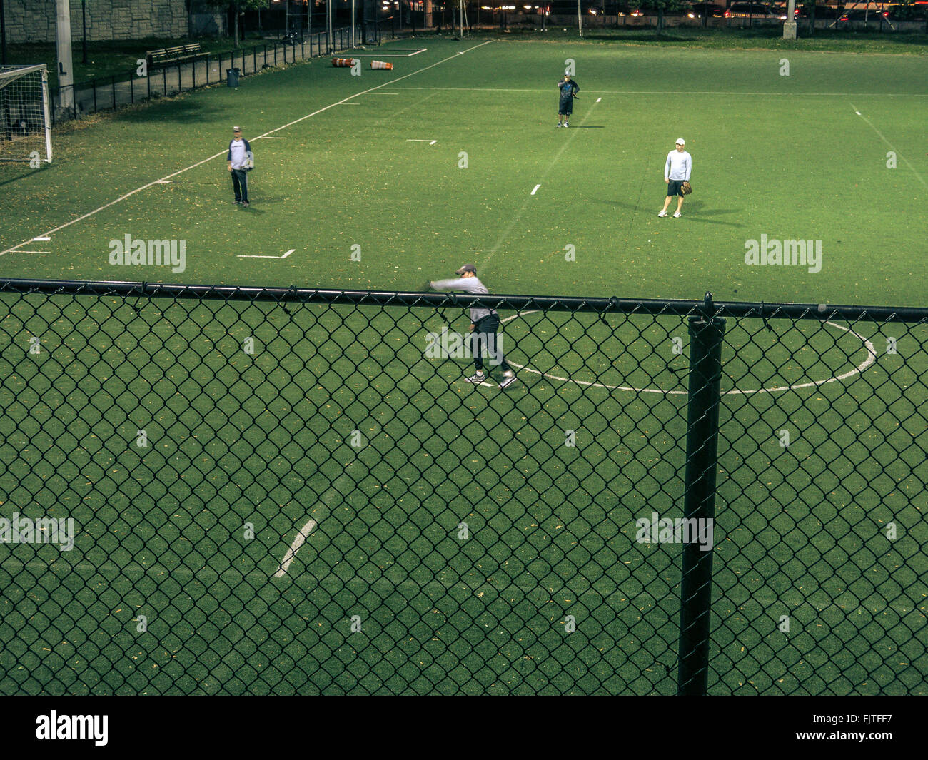 High Angle View Of Men Playing Sports On Field Stock Photo