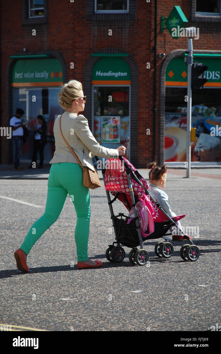 mother and child crossing Headington Oxford United Kingdom Stock Photo