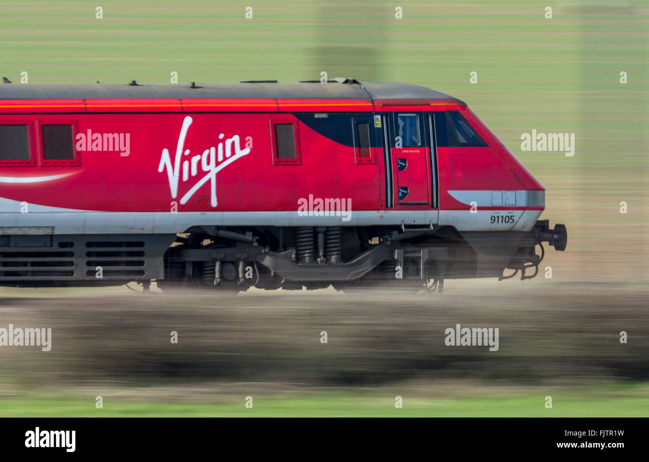 The new Inter City East Coast franchise Virgin and Stagecoach electric locomotive VTEC 91105 in the new red livery. Stock Photo