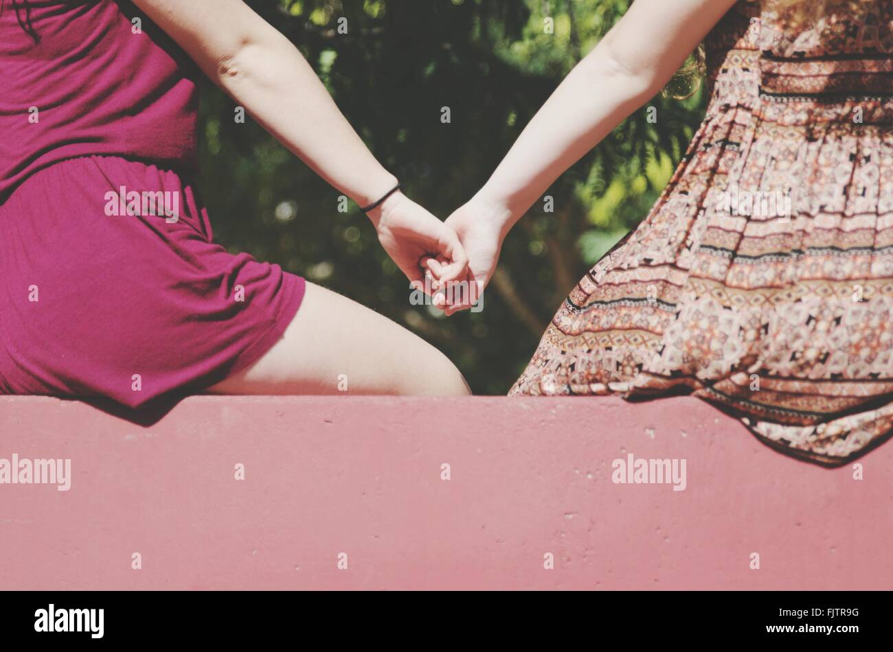 2 Friends Holding Hands