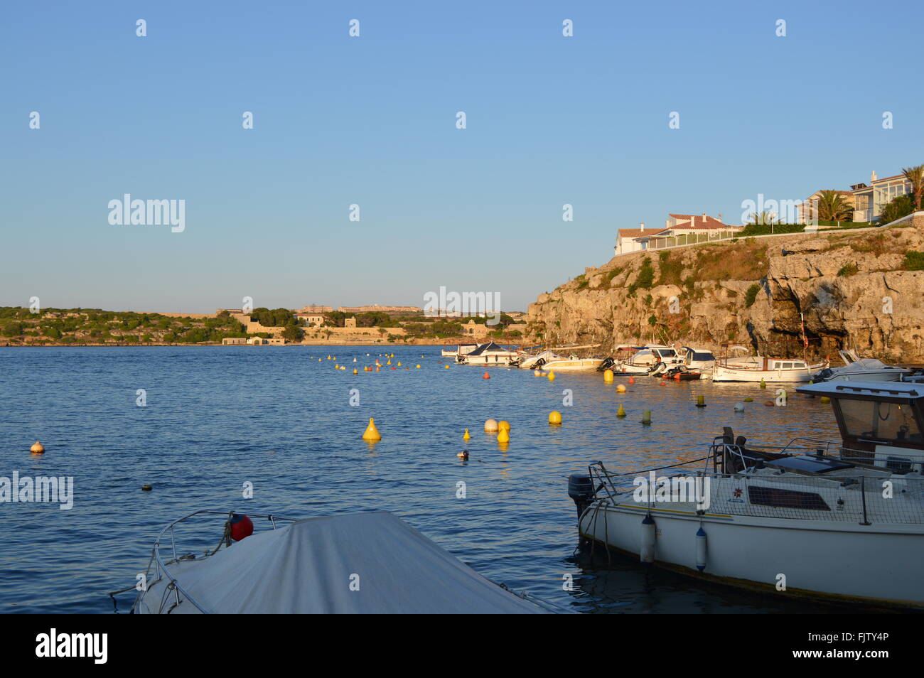 Cales Fonts Menorca. Sun setting on bay. Stock Photo