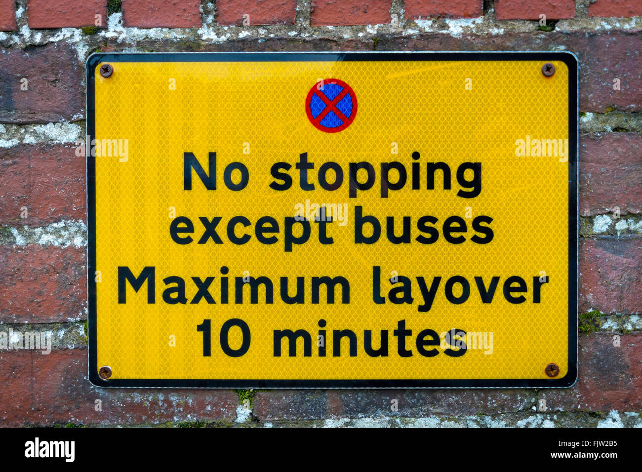 Bus Stop Restriction Sign notice No Stopping except buses maximum layover 10 minutes Stock Photo