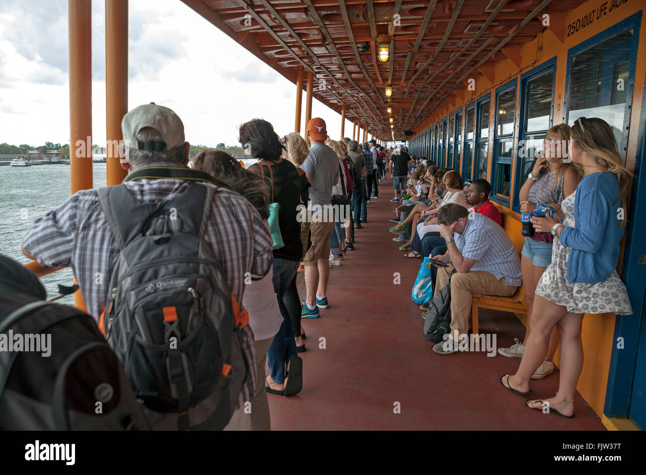Passengers enjoy the views on the Staten Island Ferry in New York City. Stock Photo