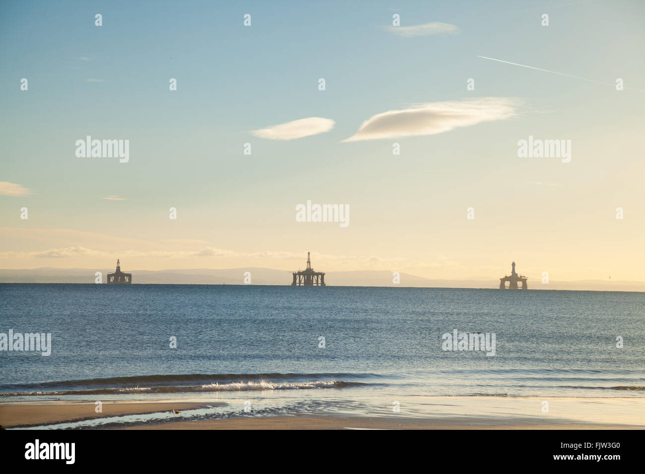 Three oil rigs sitting in the Firth of Forth near Edinburgh because of a down turn in oil production. Stock Photo