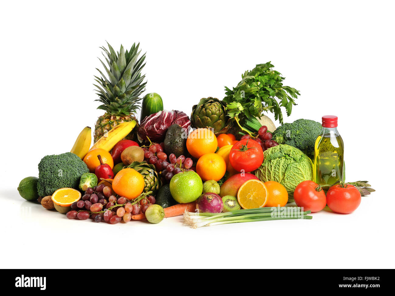 Fresh fruits and vegetables with olive oil on table isolated over white background Stock Photo