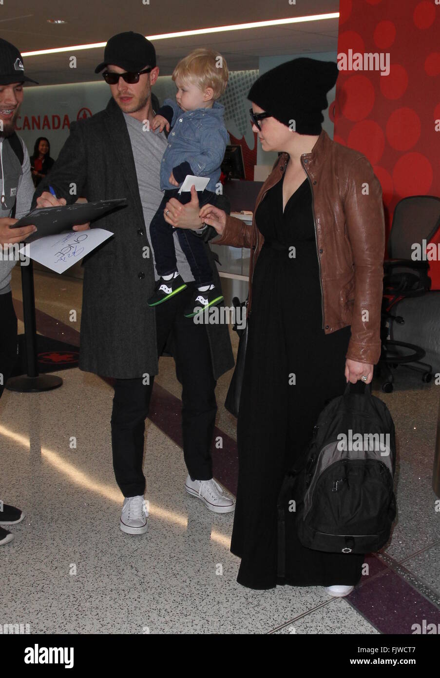 Ginnifer Goodwin, husband Josh Dallas, and their son Oliver arrive at