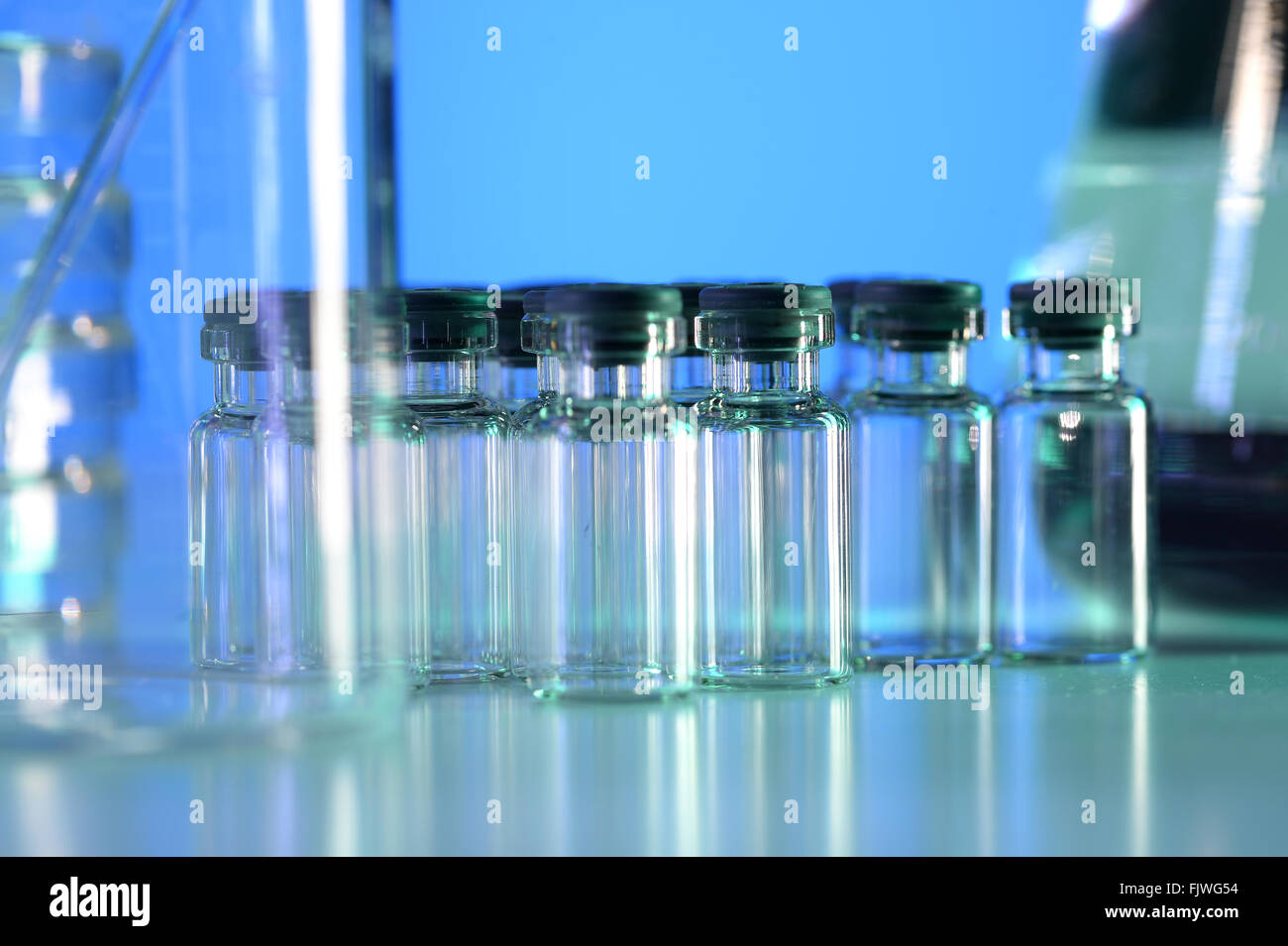 Vial in laboratory under blue light Stock Photo Alamy