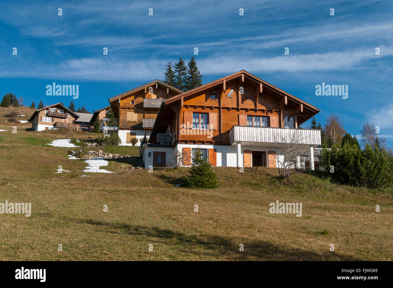 Chalets in Eggberge, a hamlet on a terrace above the town of Flüelen, Uri, Switzerland. Stock Photo