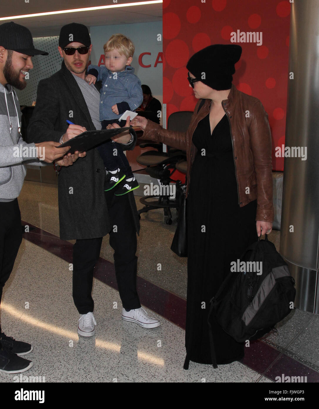 Ginnifer Goodwin, husband Josh Dallas, and their son Oliver arrive at