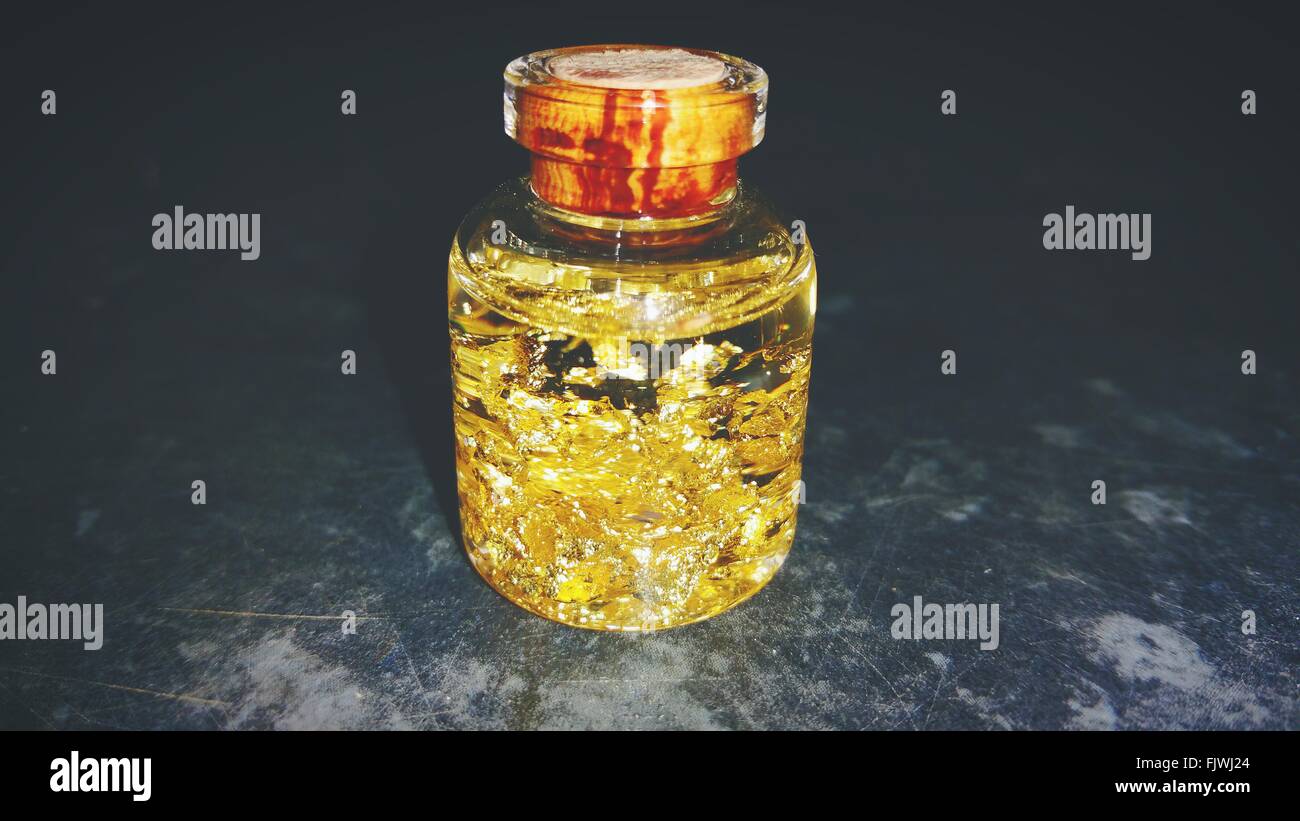 Gold flakes in liquid hires stock photography and images Alamy