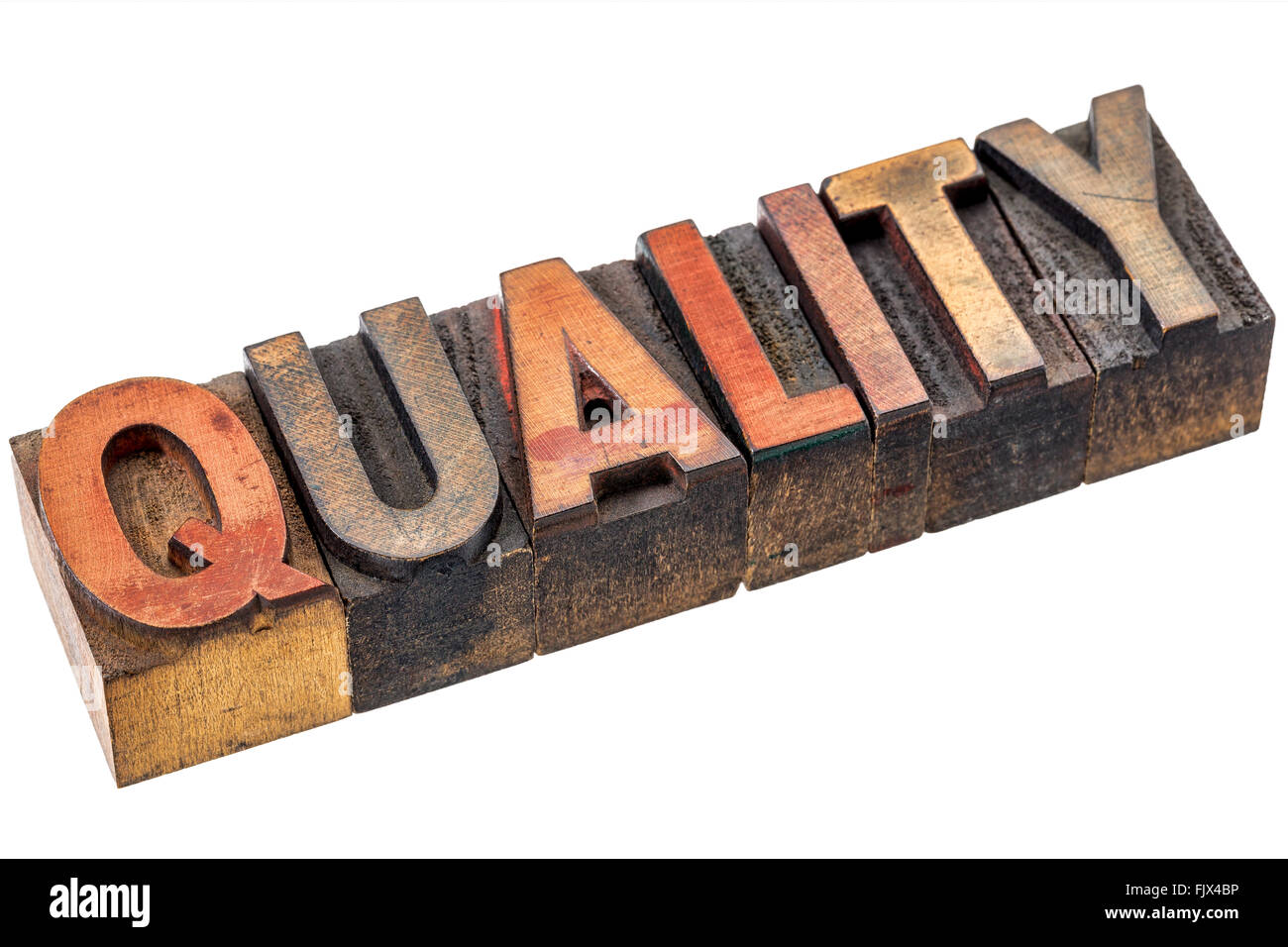 quality word abstract  - an isolated banner in vintage letterpress wood type stained by color inks Stock Photo