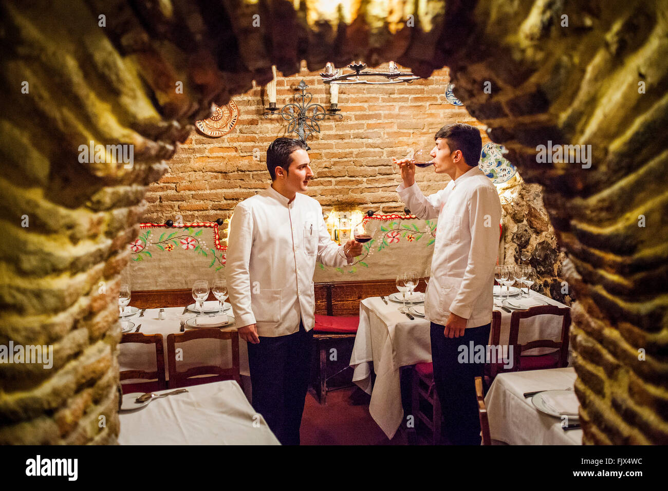 Sobrino de Botin restaurant, waiters, testing the wine, calle Cuchilleros 17. Madrid, Spain. Stock Photo