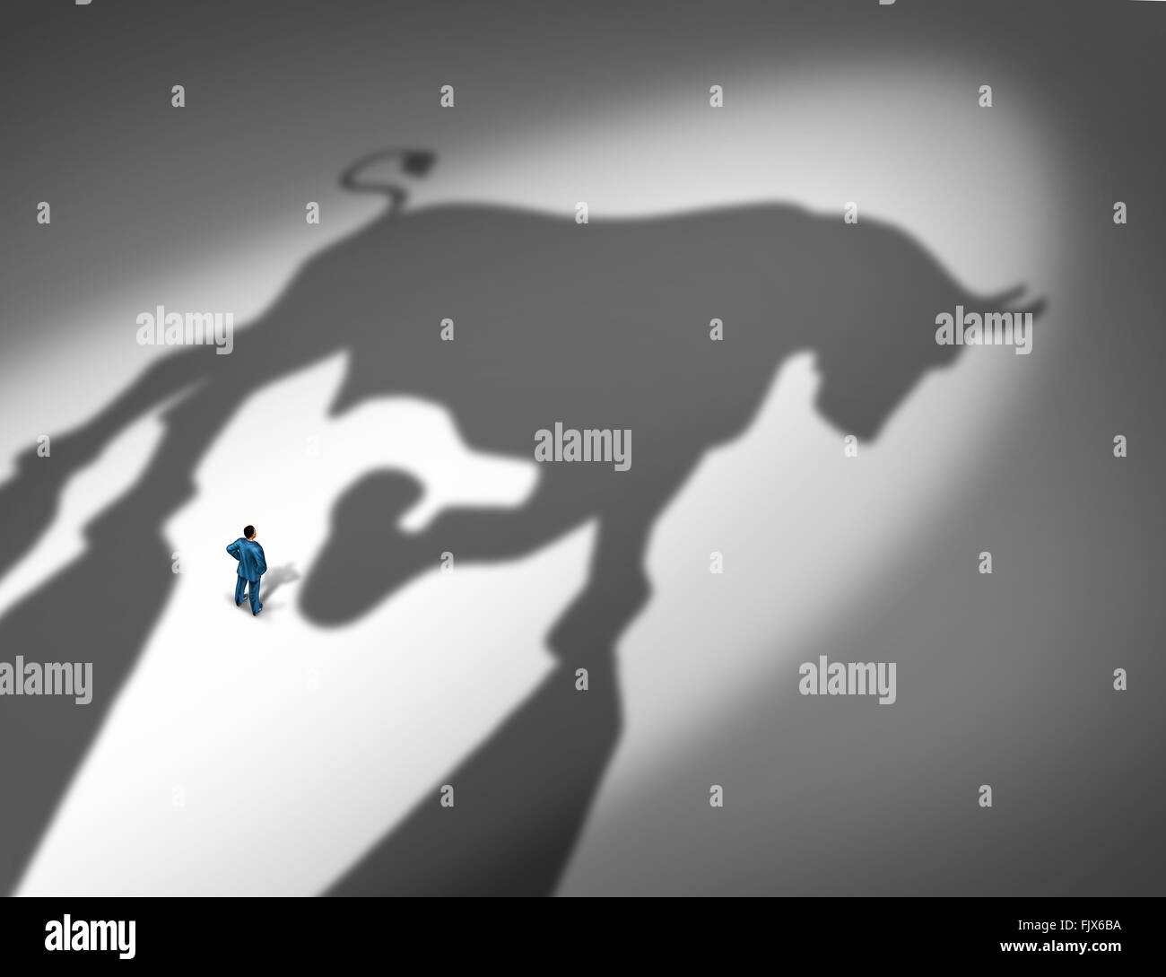 Stock market growth indicator and financial business trend concept as the cast shadow of a bull looming over a businessman as a Stock Photo