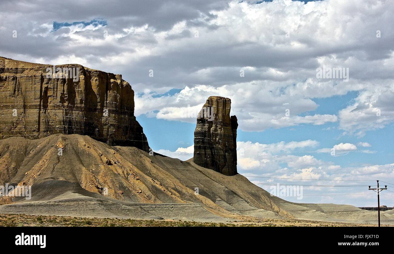 Scenic View Of Rock Formations Against Cloudy Sky Stock Photo