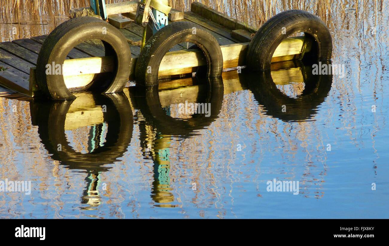 Boat With Reflection In Water Stock Photo