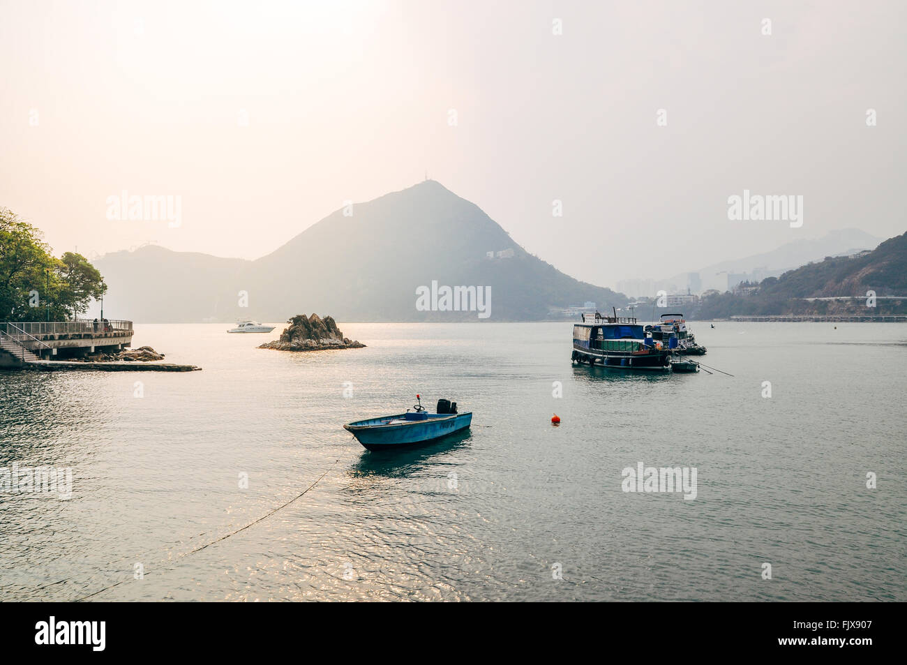 Nautical Vessels On Lake By Mountain Against Sky Stock Photo