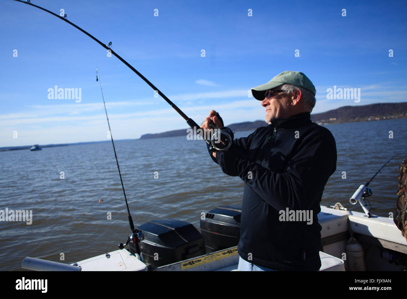 Reeling in fish hi-res stock photography and images - Alamy