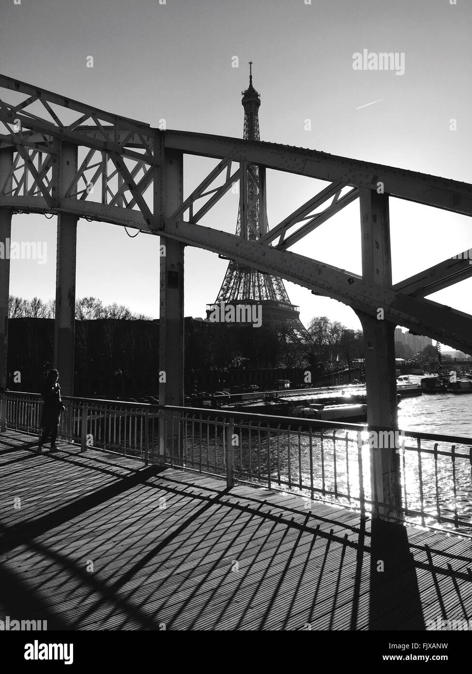 Eiffel tower through bridge architecture hires stock photography and