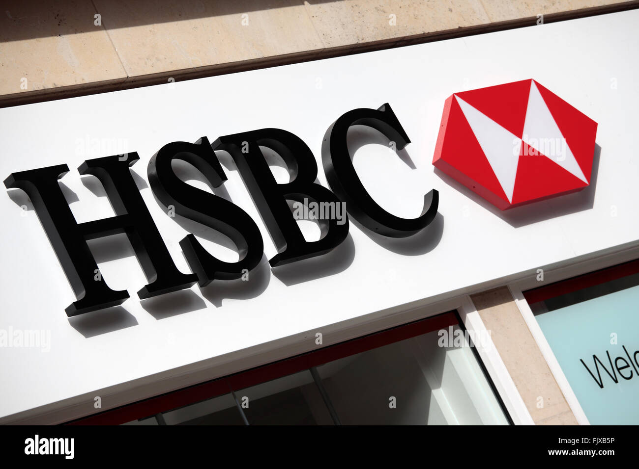 HSBC sign above the entrance to a branch of HSBC Bank in Knightsbridge London. Stock Photo