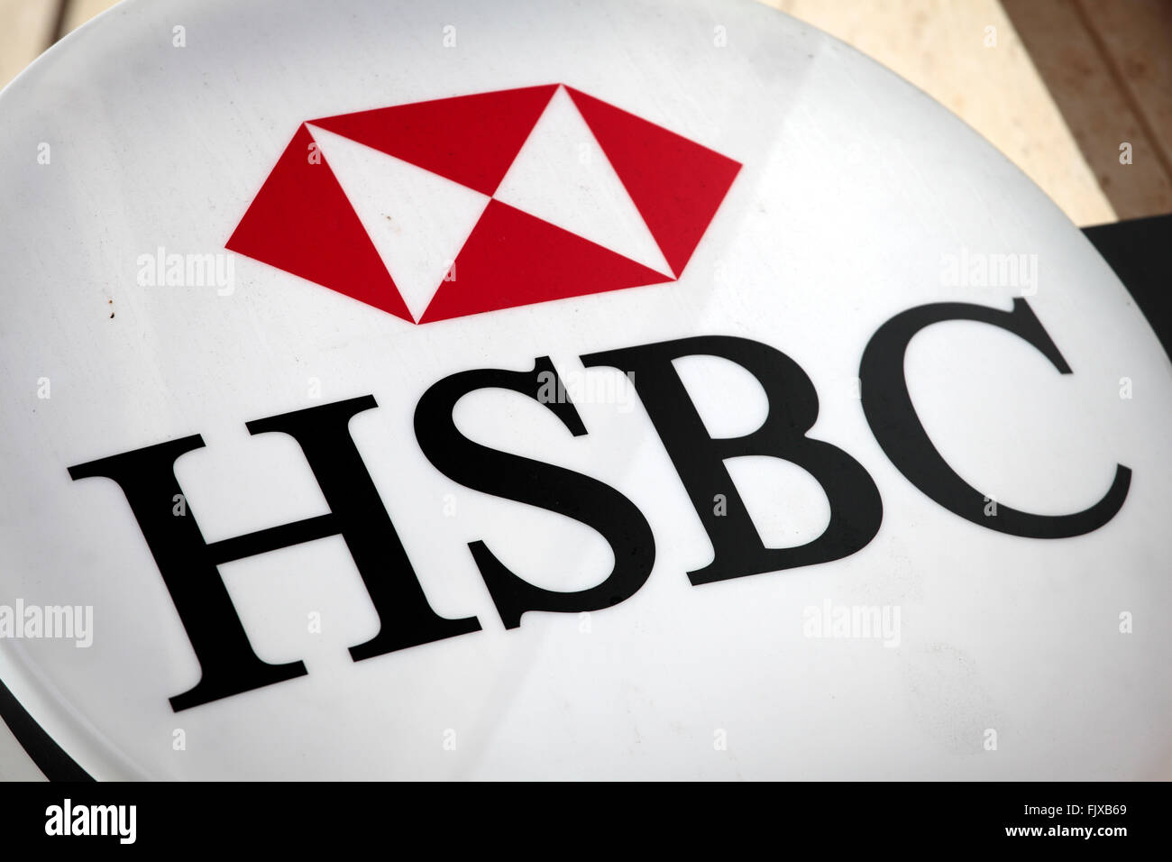 Illuminated HSBC sign above the entrance to a branch of HSBC Bank in Knightsbridge London. Stock Photo