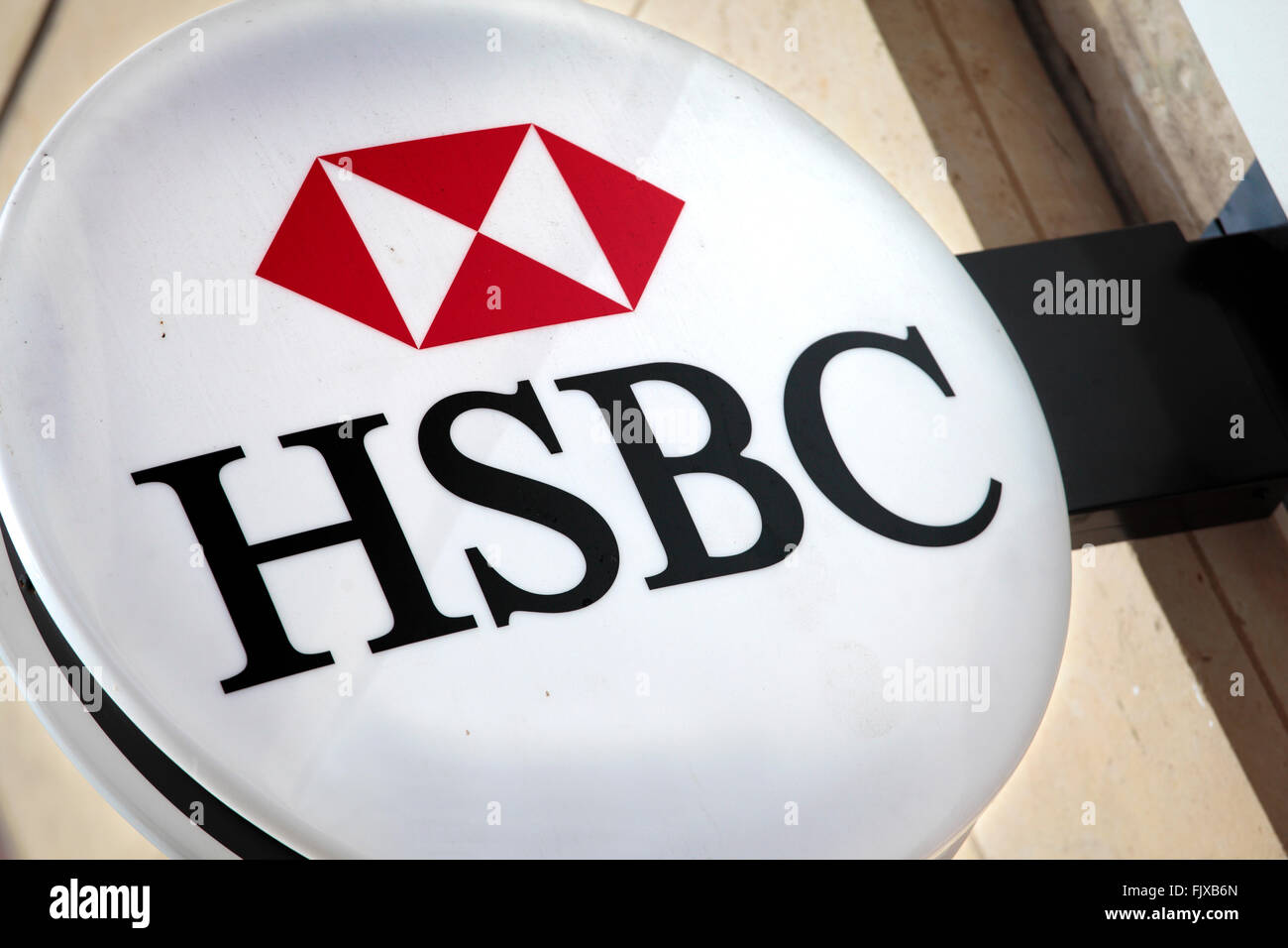 Illuminated HSBC sign above the entrance to a branch of HSBC Bank in Knightsbridge London. Stock Photo