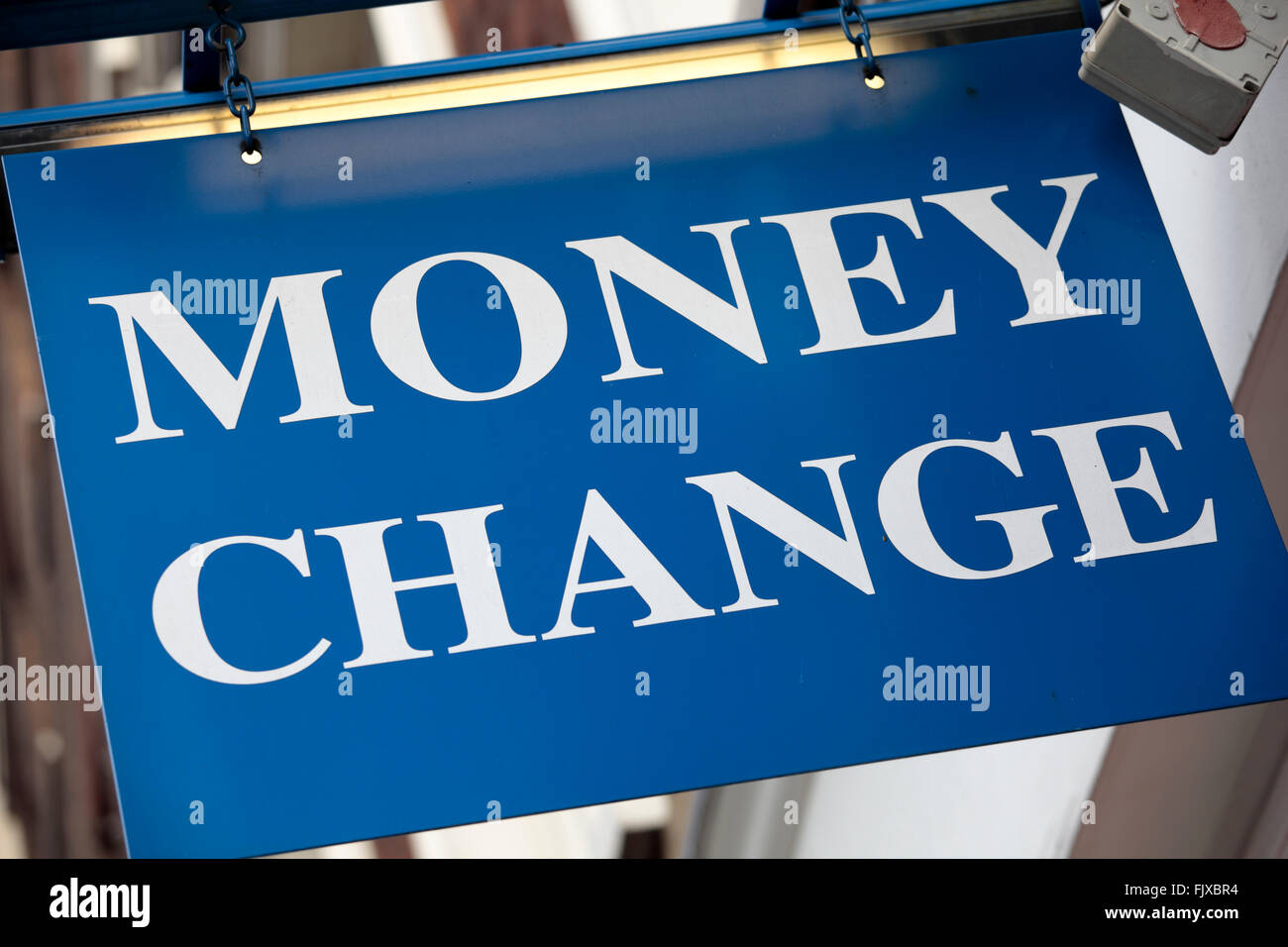 Money change sign above the entrance to a currency exchange office in