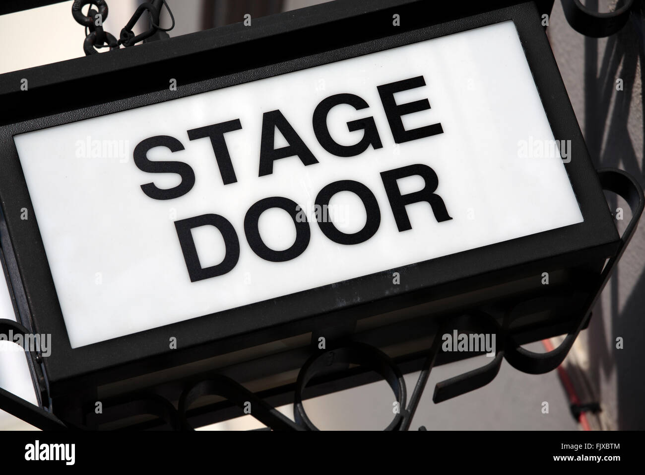 Stage door sign in black metal and white. Stock Photo