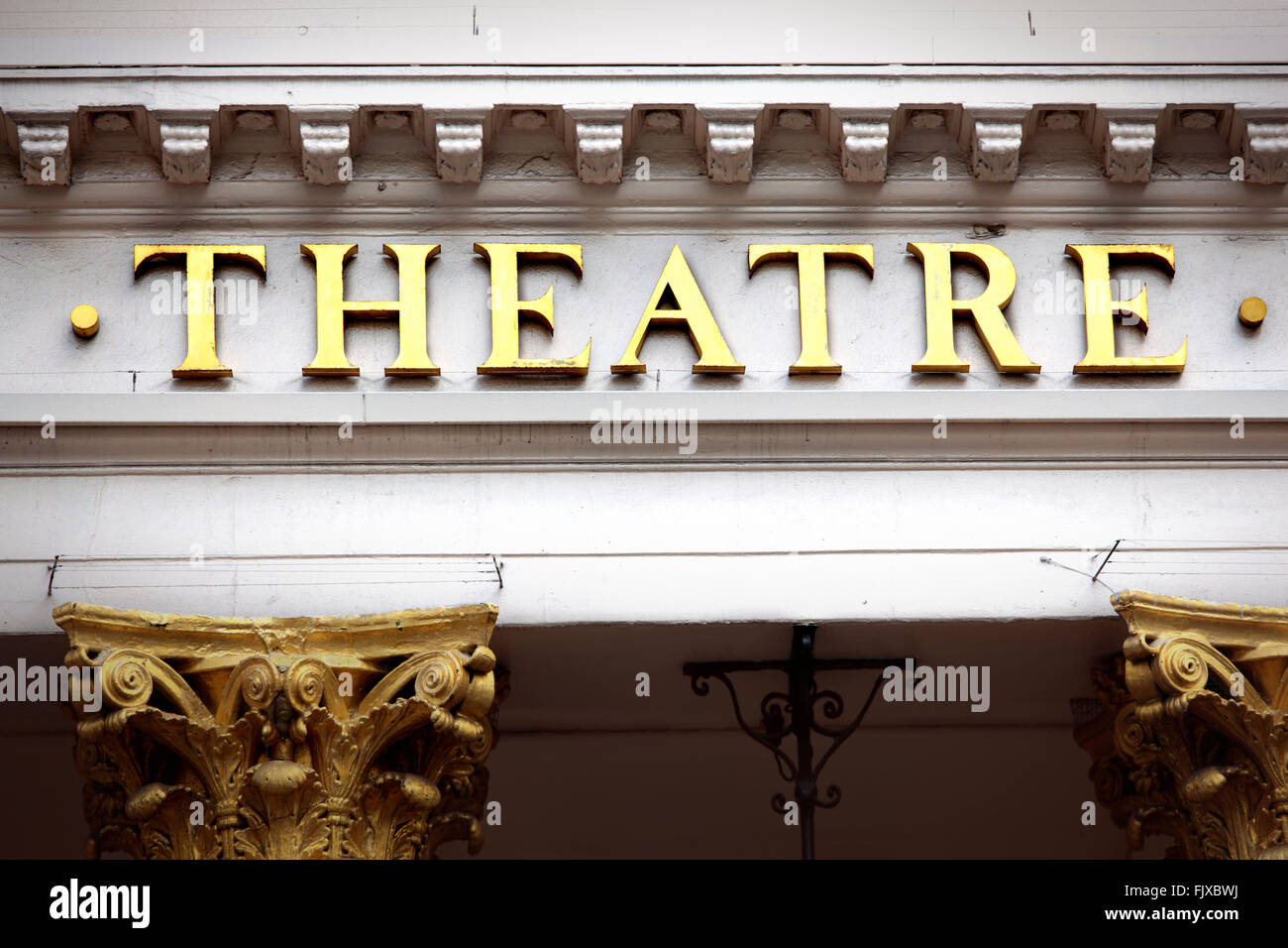 Old theatre sign and facade in gold and white. Stock Photo
