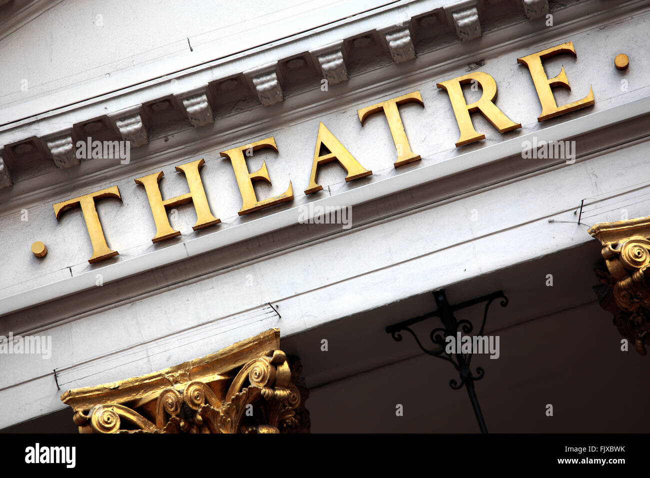 Theatre sign and facade in gold and white. Stock Photo