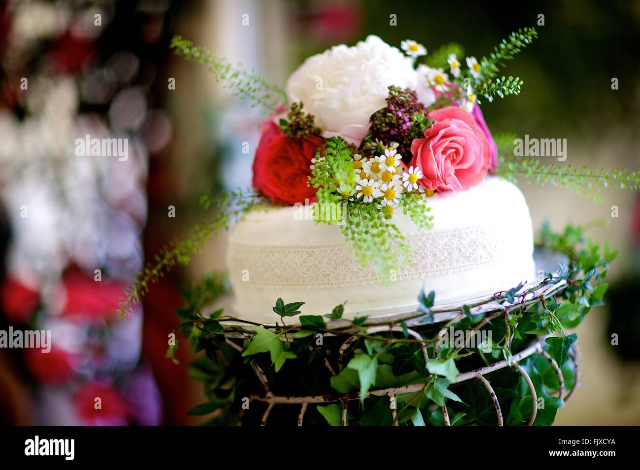 Wedding, Event, Banquet or special occasion table decoration and flowers, bride, groom, daisies and roses Stock Photo