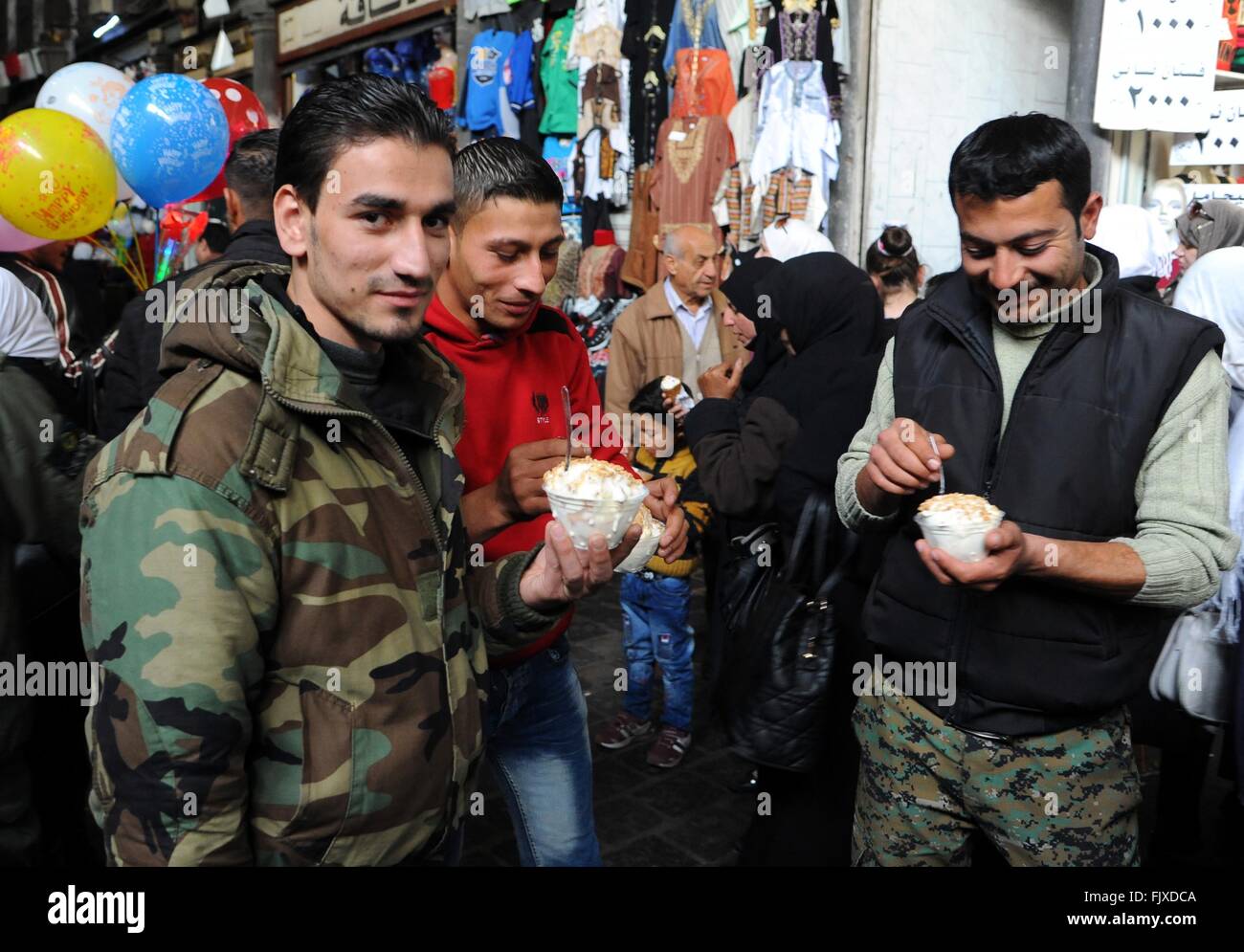 Syrians Eating Damascus, Syria. 3rd Mar, 2016. Syrian soldiers eat ice cream in the ...