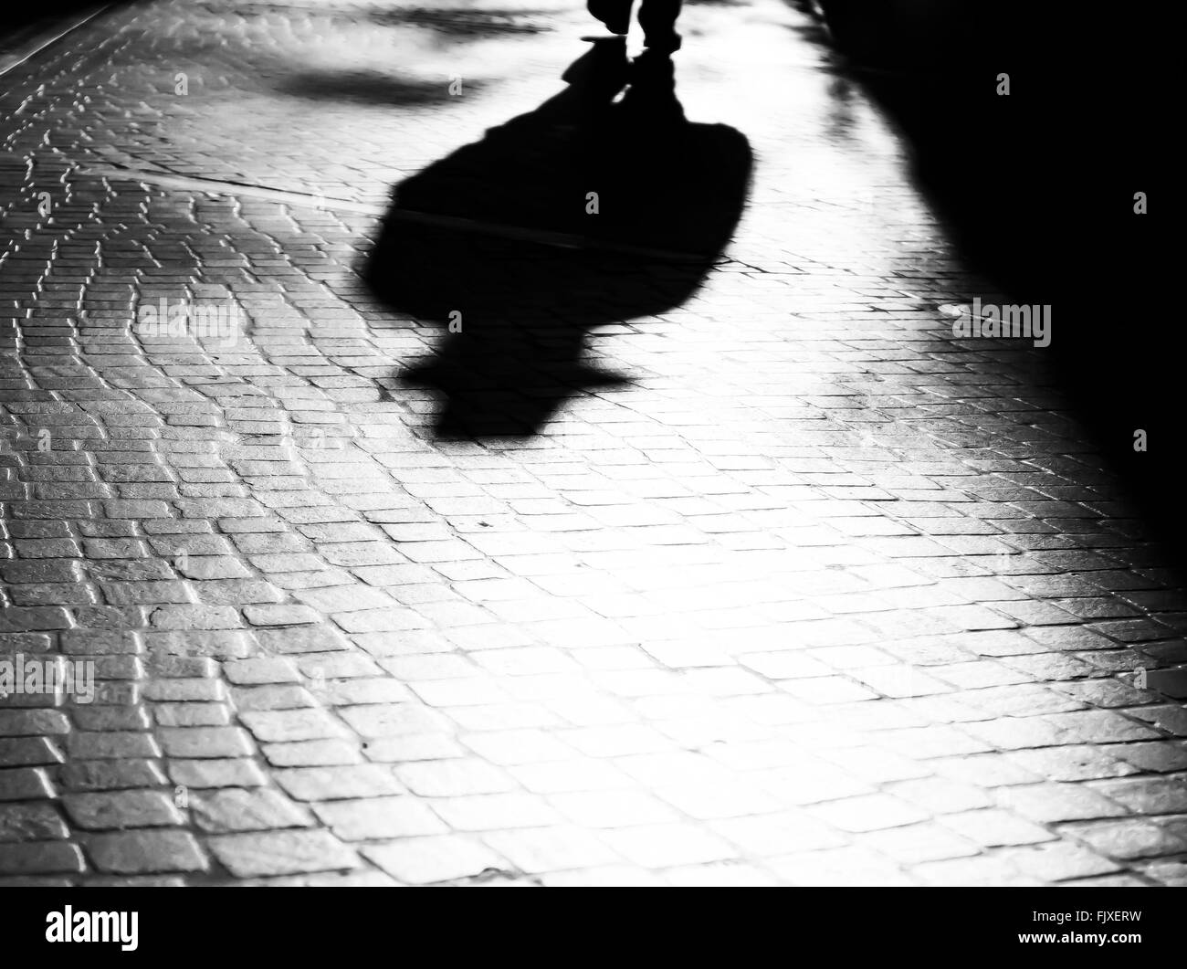 Shadow Of Person On Street Stock Photo
