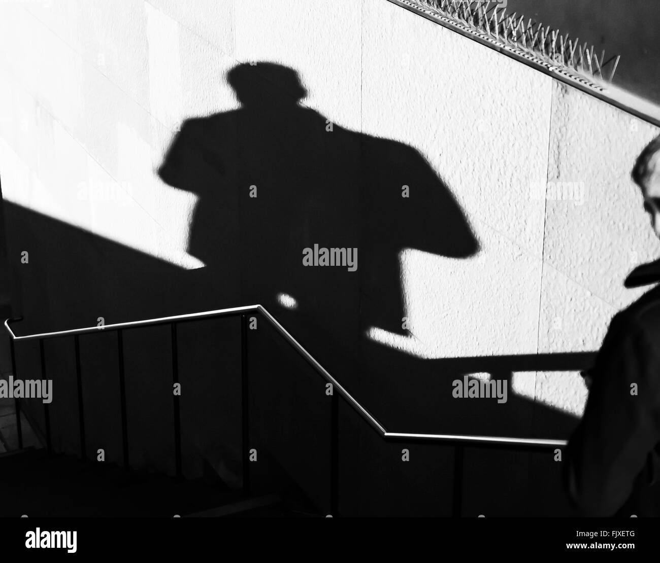 Shadow Of Man On Wall Stock Photo