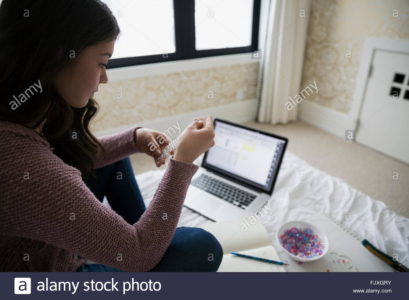 Girl teenager laptop bedroom bed hires stock photography and images