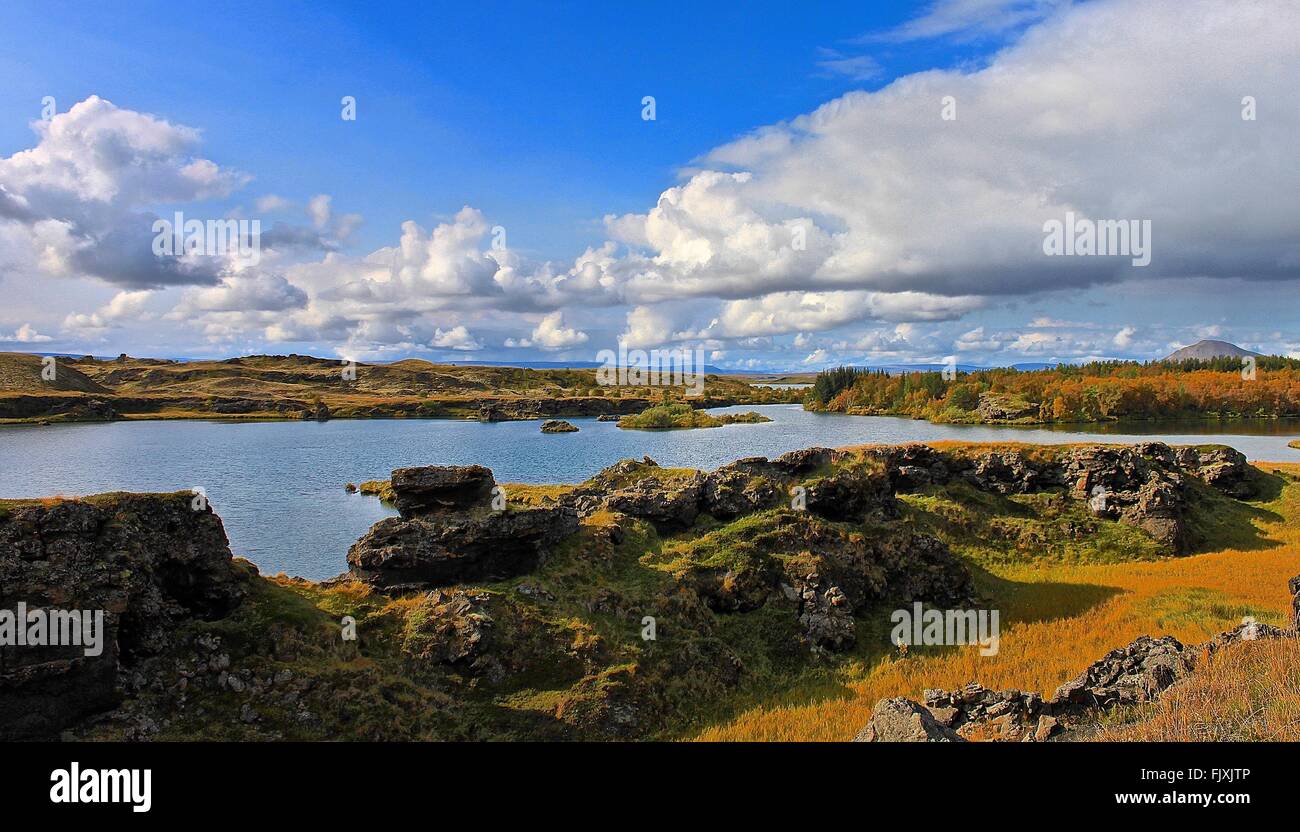 Scenic View Of Landscape Against Cloudy Sky Stock Photo