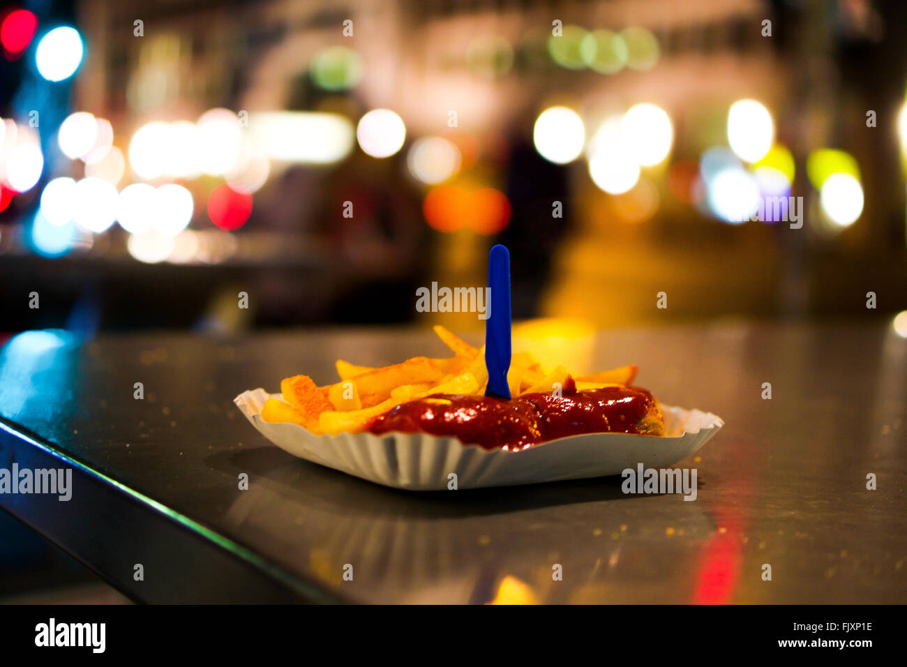 Currywurst Served In Plate On Table Stock Photo
