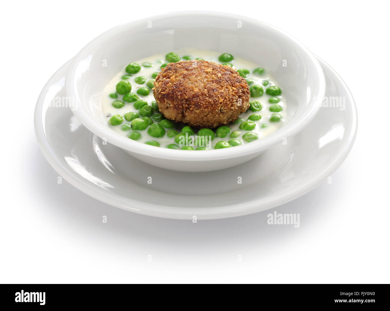 green peas fozelek (thick vegetable stew) and fasirt (fried meatball), hungarian cuisine Stock Photo